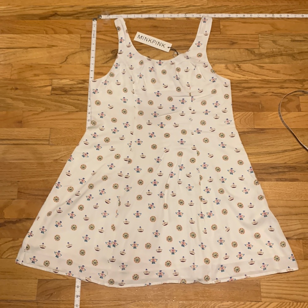Cute, cut out, open back, a-line dress in small Aztec/native Indian print design